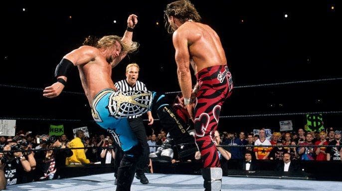 Chris Jericho and Shawn Michaels wrestle in the ring during WrestleMania 19